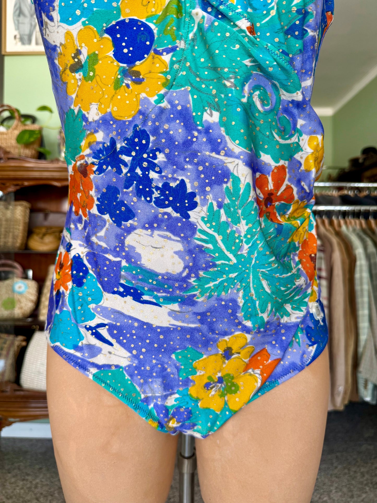 Costume intero lilla con fiori arancio/gialli- TG. 44/46