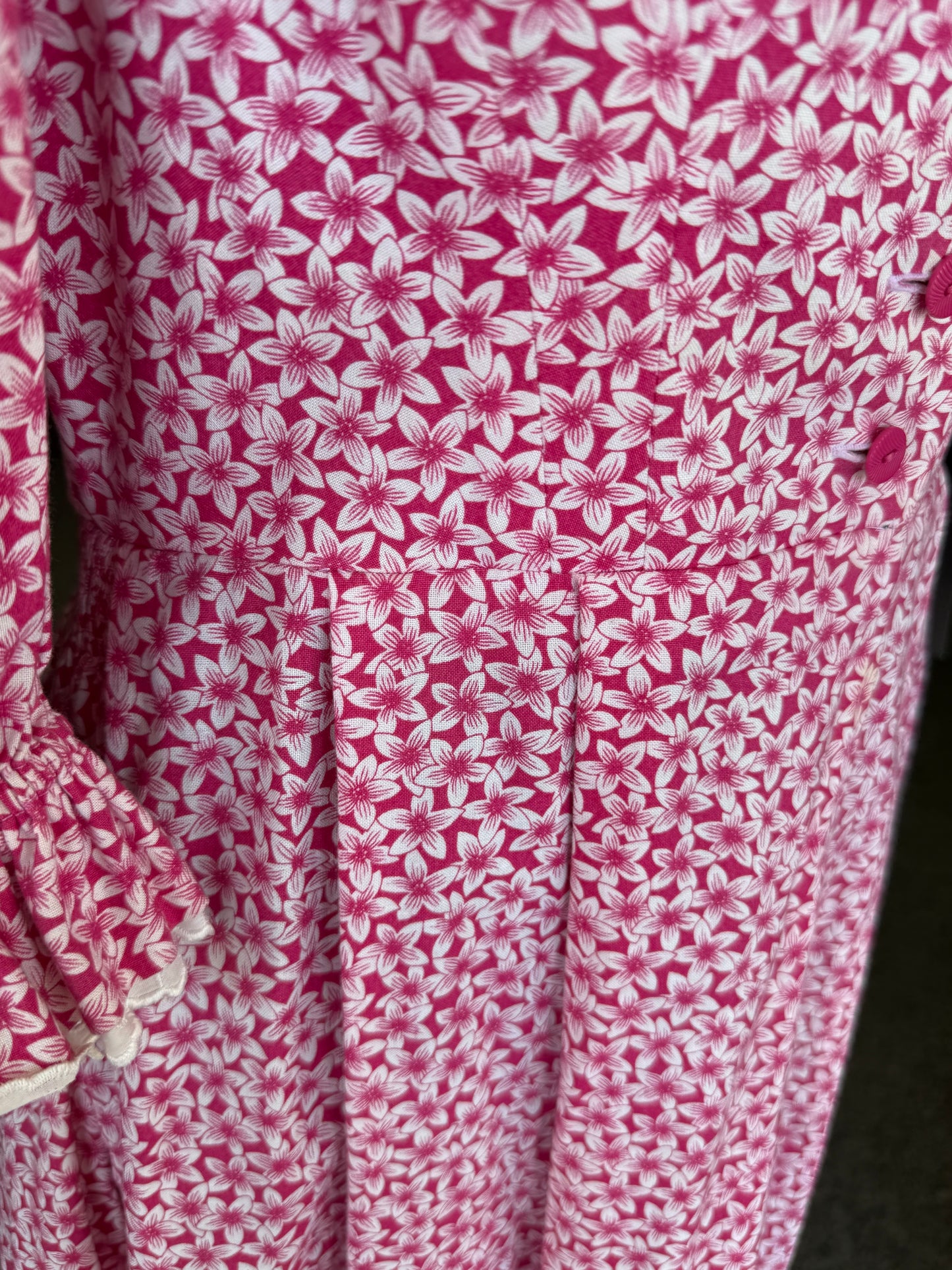 Abito tirolese rosa con micro-fiori
- TG. 44/46